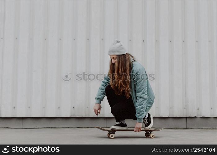 skateboarder girl riding her skate city