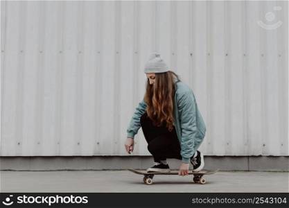 skateboarder girl riding her skate city