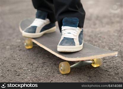 Skateboarder rides on the board.