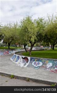 Skateboarding with graffiti in the public gardens in Quito