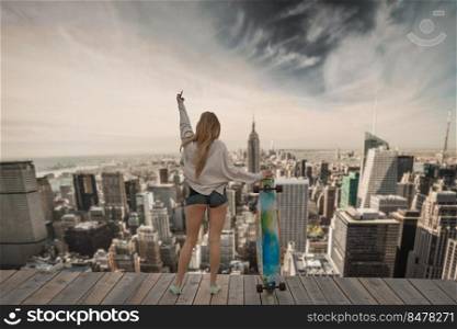 Skater girl on the top of a builduing in NYC