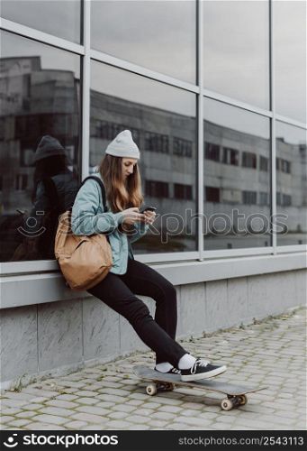 skater girl urban sitting building
