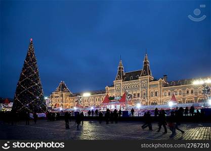 skating-rink on red square in moscow at night. Big New Year tree. GUM trading house