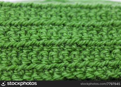 Skein of wool and knitted piece background
