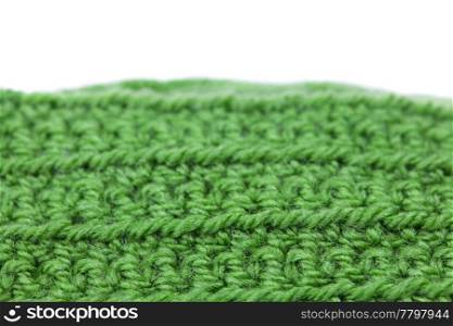 Skein of wool and knitted piece isolated on white