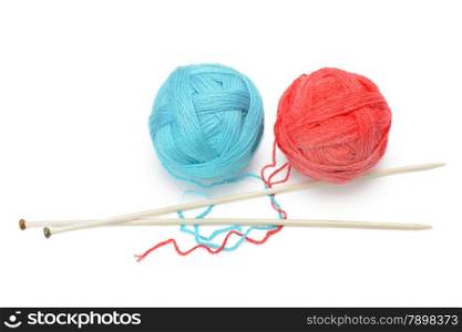 skeins of yarn and knitting needles isolated on a white background