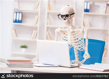 Skeleton businessman working in the office