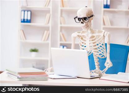 Skeleton businessman working in the office
