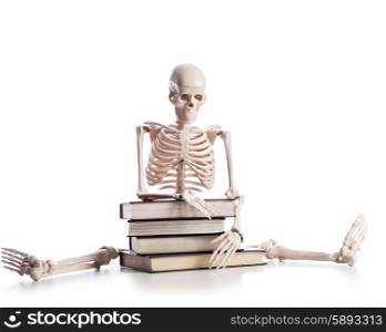 Skeleton with books isolated on white