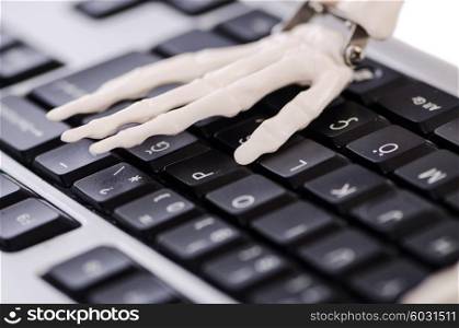 Skeleton working on the keyboard