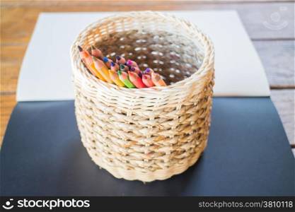 Sketchbook and many different colored pencils, stock photo