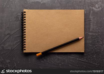 Sketchbook or notebook paper at stone background surface table, top view