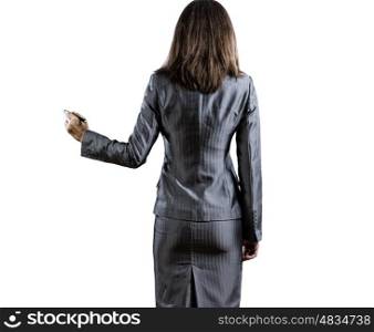 Sketching ideas. Back view of businesswoman standing against white background