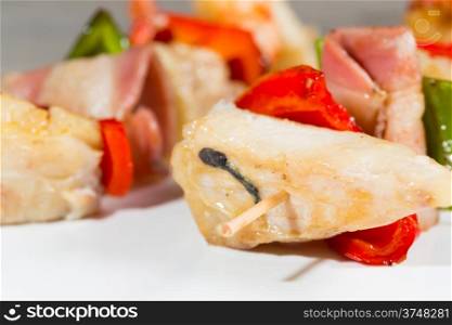 Skewer fresh cod with grilled vegetables