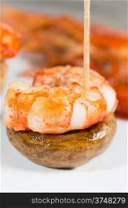 Skewer shrimp cooked with fresh mushrooms grilled