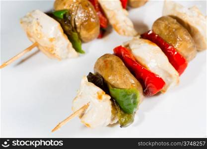 Skewered chicken breast with grilled vegetables cooked