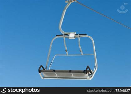 Ski lift chairs on bright winter day&#xA;