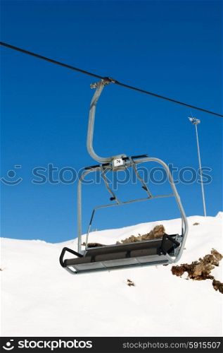 Ski lift chairs on bright winter day&#xA;
