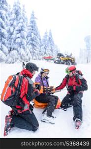 Ski patrol team rescue woman skier with broken arm