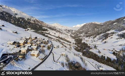 Ski resort and village covered in snow in the Alps