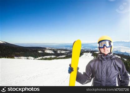 Ski slope in High Tatras mountains. Frosty sunny day. Ski slope and skier