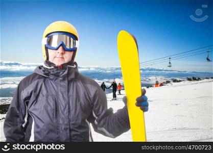 Ski slope in High Tatras mountains. Frosty sunny day. Ski slope and skiers