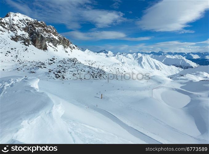 Ski track in morning winter Silvretta Alps (Tyrol, Austria). All people are unrecognizable.