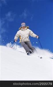 Skier coming down hill smiling