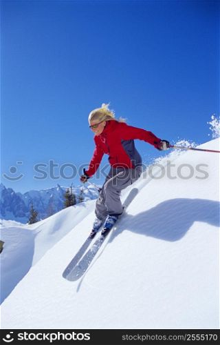Skier coming downhill smiling