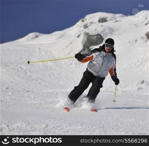 skier free ride downhill at winter season on beautiful sunny day