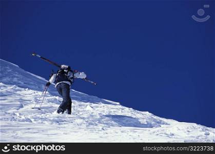 Skier Hiking Up Mountain
