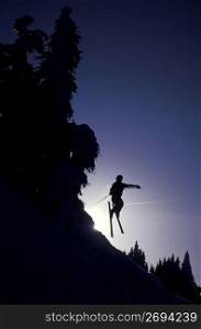 Skier jumping off hill