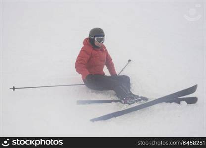 Skier sitting in the snow, Whistler, British Columbia, Canada