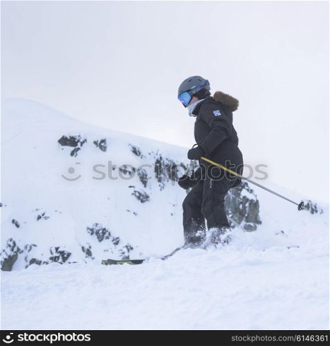 Skier skiing on snow covered mountain, Whistler, British Columbia, Canada