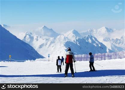 skiers on the mountain backdrop