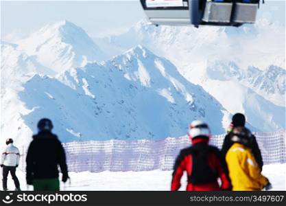 skiers on the mountain backdrop