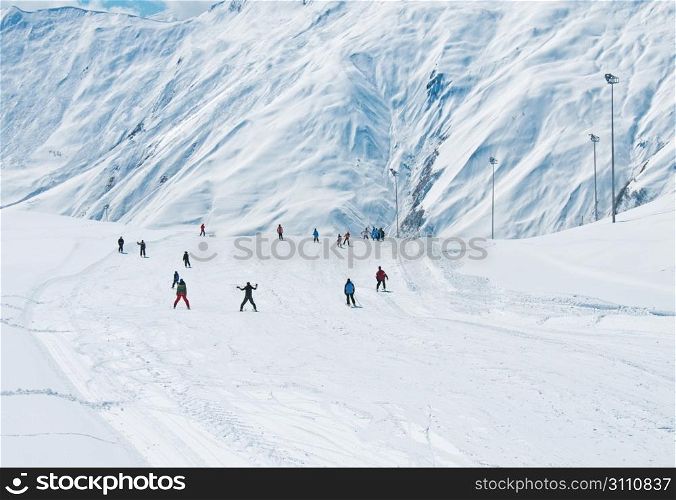 Skiers on the mountain slope