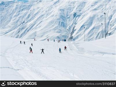 Skiers on the mountain slope