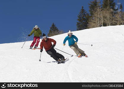 Skiers Skiing Down Slope