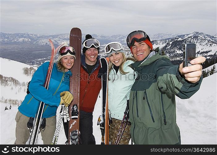 Skiers Taking Their Picture With Cell Phone