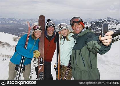 Skiers Taking Their Picture With Cell Phone