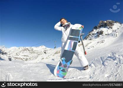 skiing downhill on fresh powder snow with sun and mountains in background