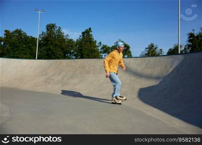 Skilled teenager boy wearing casual clothing and in roller blades riding on r&. Inline skates sport at summer. Skilled teenager boy wearing casual clothing and in roller blades riding on r&