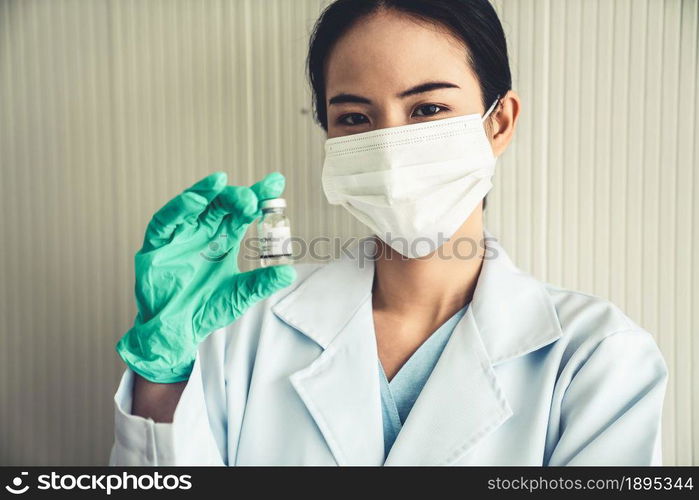 Skillful doctor prepare vaccine proficiently before injection . Covid 19 and coronavirus vaccination center service concept .. Skillful doctor prepare vaccine proficiently before injection