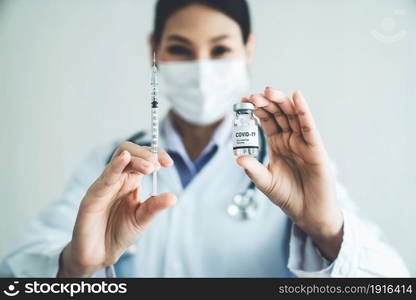 Skillful doctor prepare vaccine proficiently before injection . Covid 19 and coronavirus vaccination center service concept .. Skillful doctor prepare vaccine proficiently before injection