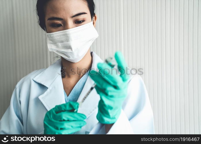 Skillful doctor prepare vaccine proficiently before injection . Covid 19 and coronavirus vaccination center service concept .. Skillful doctor prepare vaccine proficiently before injection