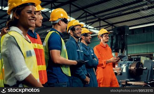 Skillful worker attending brief meeting in the factory . Industrial people and manufacturing labor concept .