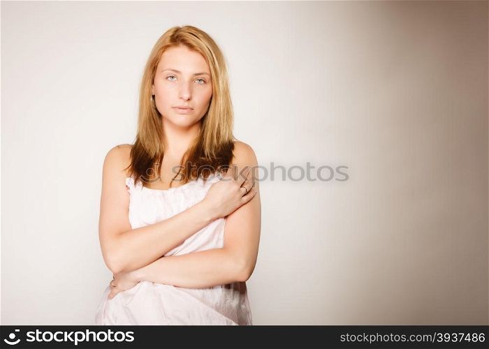 Skin care. Attractive blonde woman with no makeup, fresh face with natural make up on gray