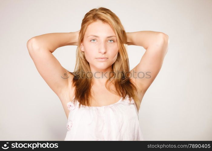 Skin care. Attractive blonde woman with no makeup, fresh face with natural make up on gray