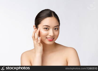 Skin care beauty woman. Beauty woman smiling applying cream. Beauty portrait of beautiful Asian Caucasian female model isolated on white. Skin care beauty woman. Beauty woman smiling applying cream. Beauty portrait of beautiful Asian Caucasian female model isolated on white.